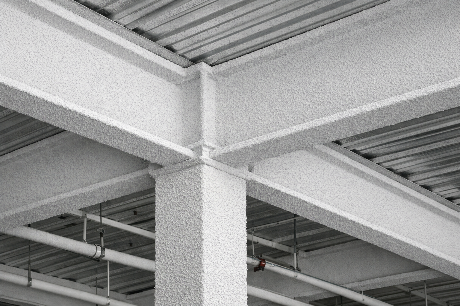 SFRM spray-applied fireproofing on structural steel beams in a Toronto commercial building